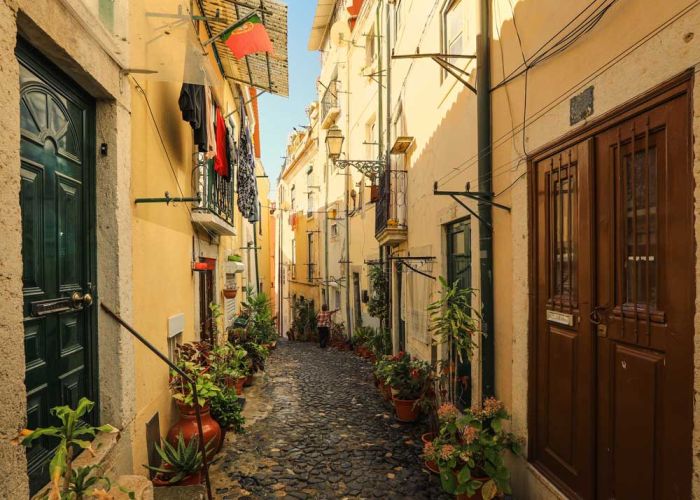 A narrow street in Alfama district in Lisbon, Portugal